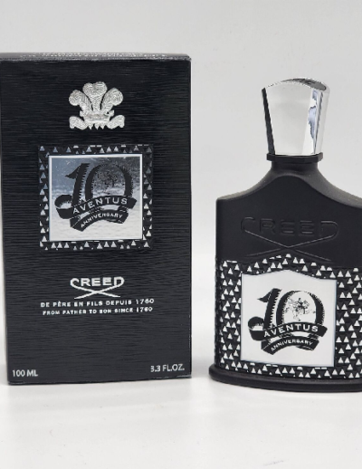 A stylish Creed 40th Anniversary cologne bottle with its black packaging.