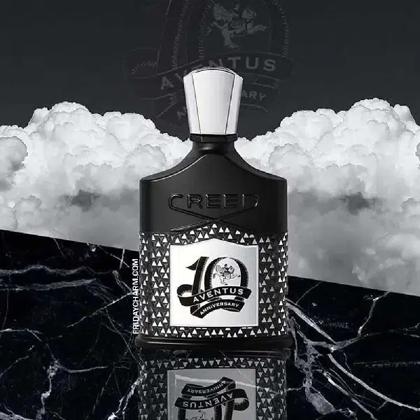 Elegant black perfume bottle with a white cap on marble surface.