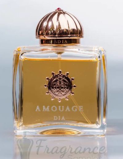 Elegant Amouage perfume bottle with golden liquid inside.