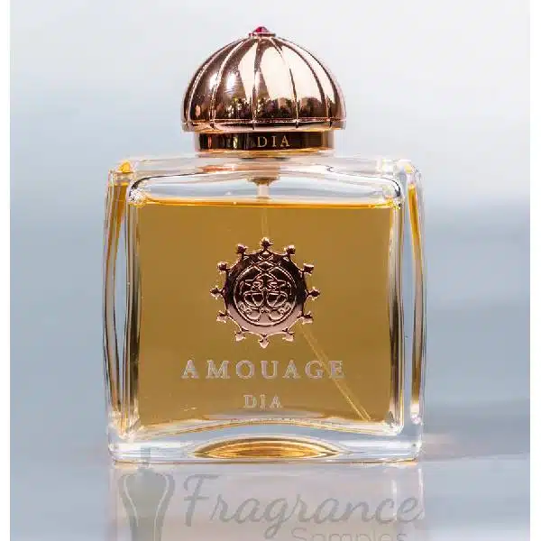 Elegant Amouage perfume bottle with golden liquid inside.