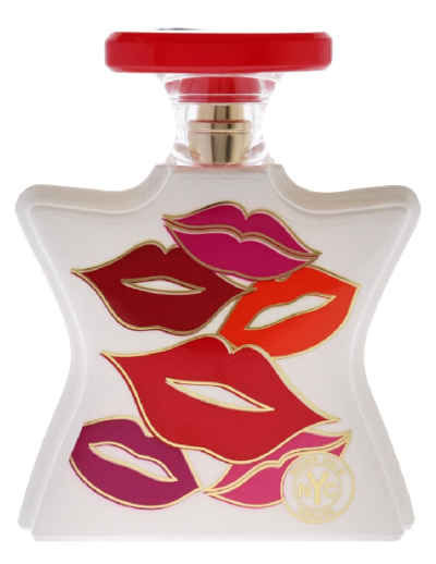 Perfume bottle with bold lip prints in red and pink on a white background.