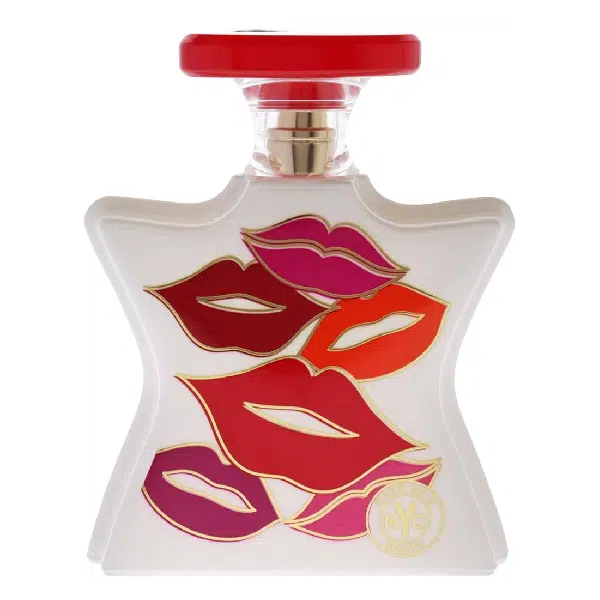 Perfume bottle with bold lip prints in red and pink on a white background.