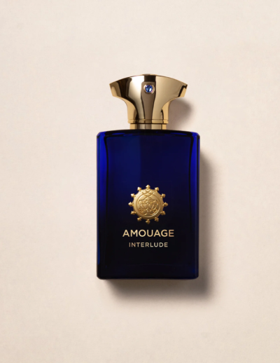 Elegant blue bottle of Amouage perfume with gold cap.