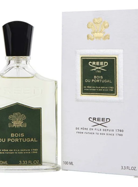 A bottle and box of Creed Royal du Portugal perfume with green labels and gold accents.