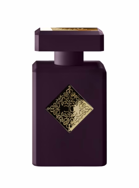 Dark purple perfume bottle with gold emblem
