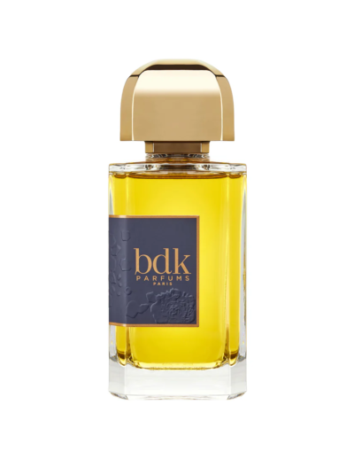 Elegant bottle of BDK Parfums infused with golden fragrance.