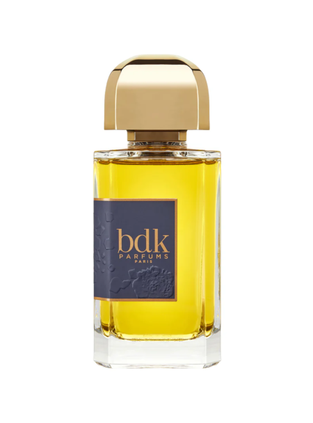 Elegant bottle of BDK Parfums infused with golden fragrance.