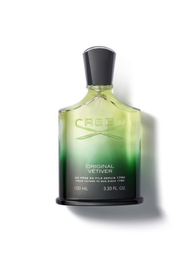 A green gradient perfume bottle with a dark cap.