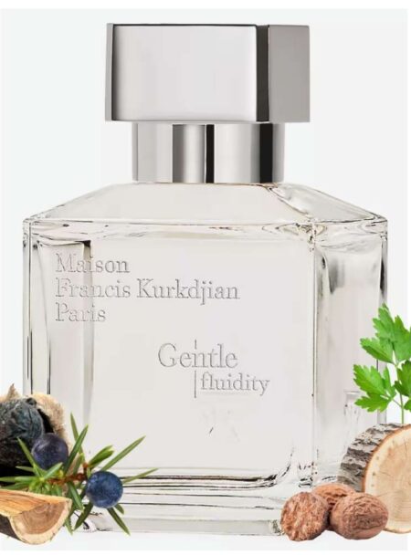 Elegant perfume bottle with floral and nutty ingredients beside it.