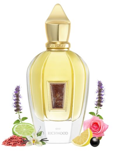Elegant perfume bottle with floral and citrus decorations.